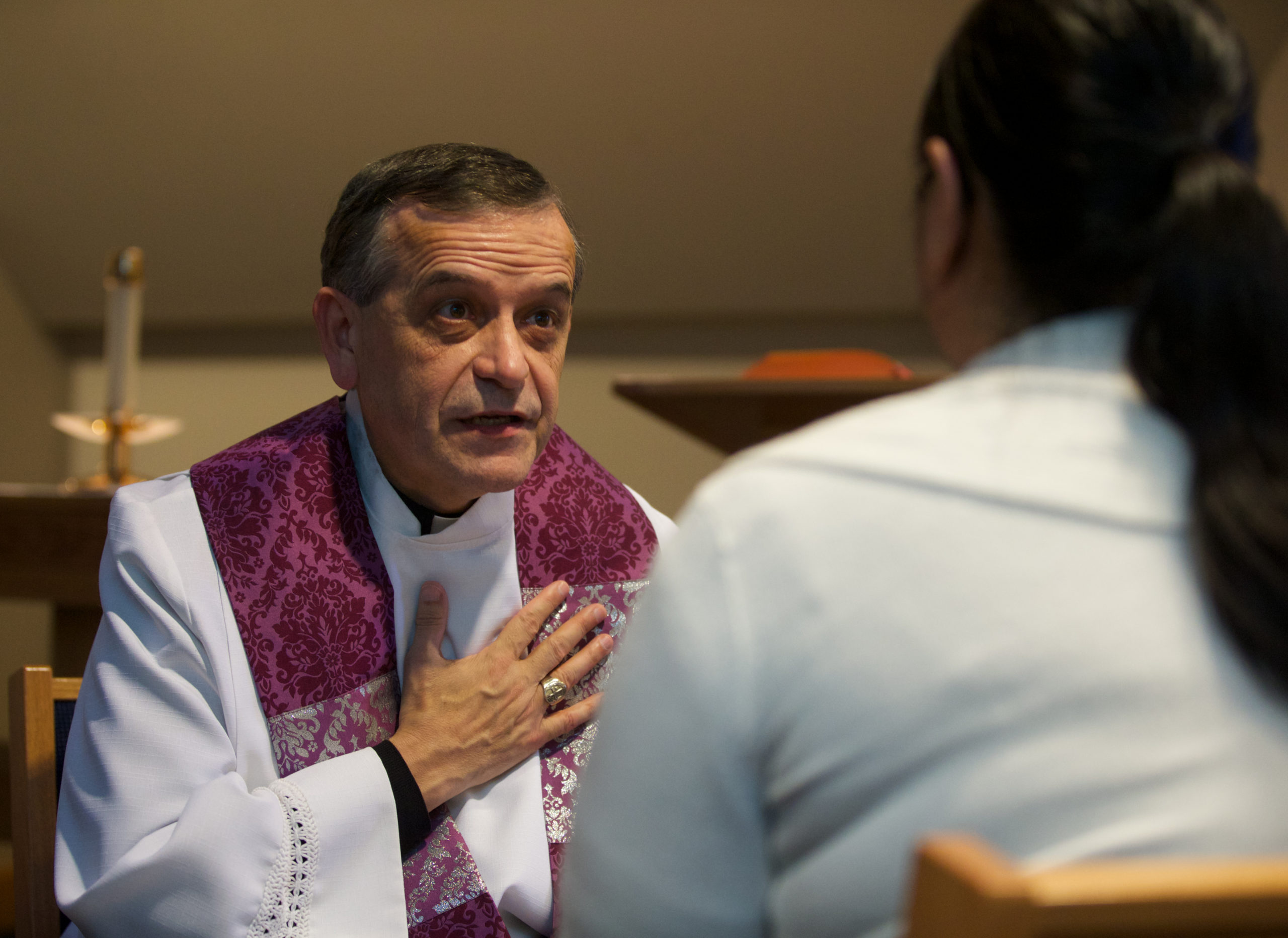 Bishop Eusebio Elizondo demonstrates confession in Seattle Friday December 13, 2013. (PHOTO by Stephen Brashear) Confession, Reconciliation, Jennifer Day