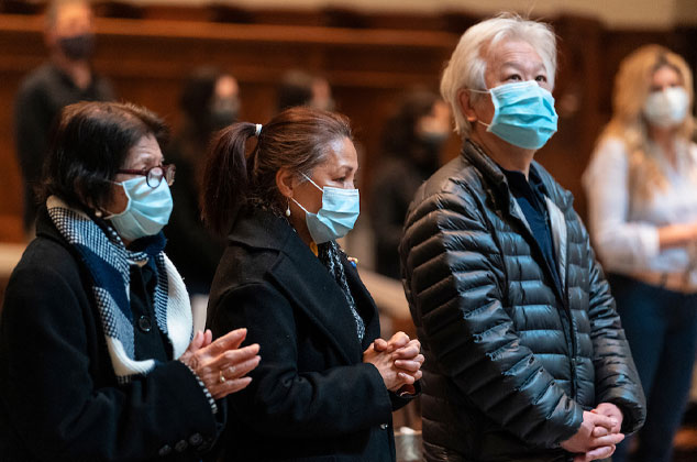 People attending mass with masks