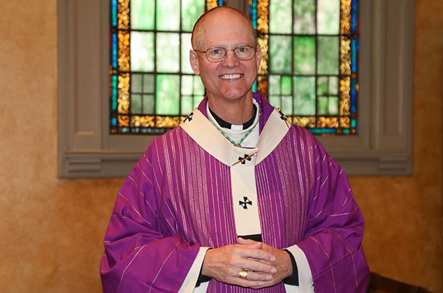 Archbishop Etienne wearing purple vestments